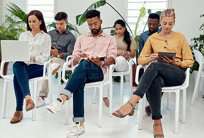 Buy stock photo Cropped shot of a diverse group of businesspeople sitting together for a presentation in the office
