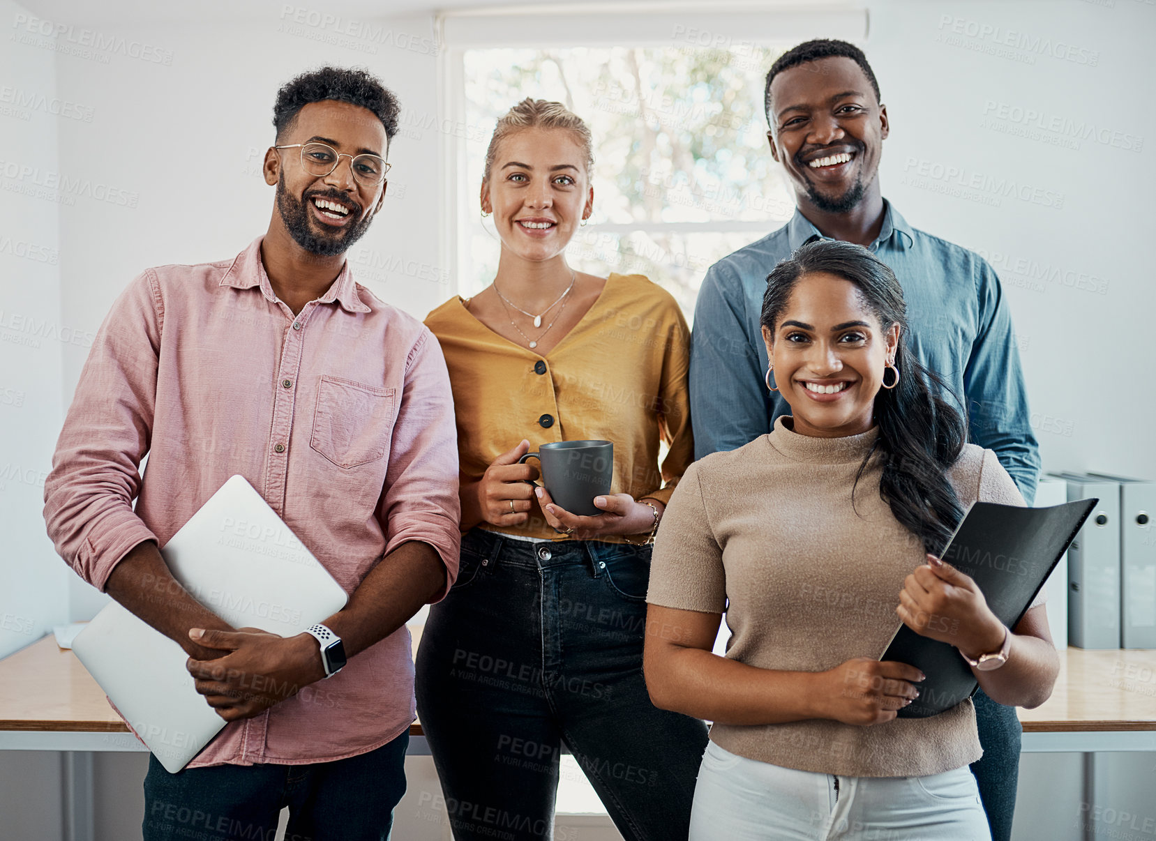 Buy stock photo Cropped portrait of a diverse group businesspeople standing together after a successful discussion in the office