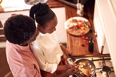 Buy stock photo Romance, couple and cooking in kitchen with hug on valentines day for dinner celebration or lunch date in home. Black people, love or happy with bonding, healthy meal preparation or top view in house