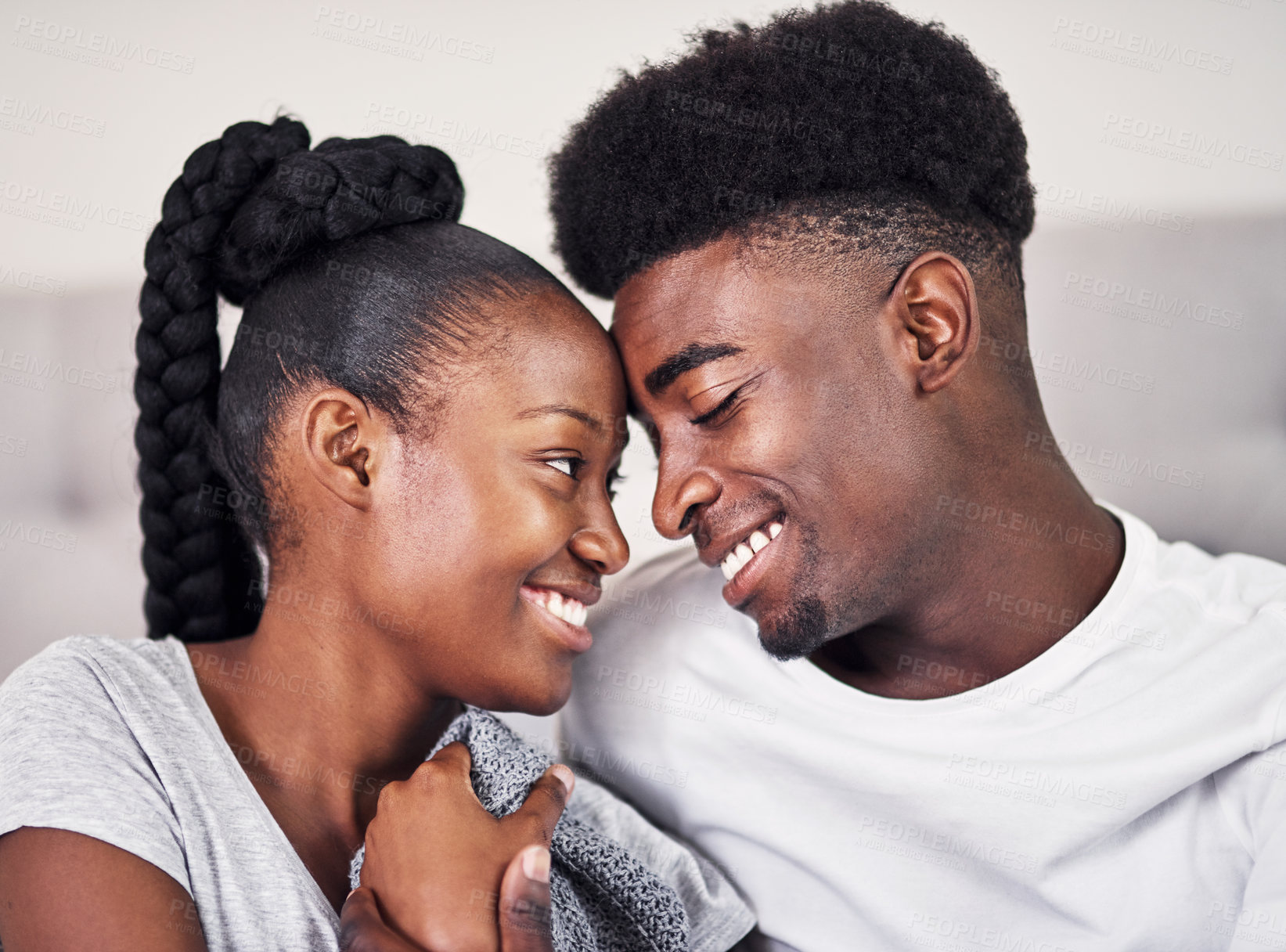 Buy stock photo Bedroom, hug and black couple with love, relationship and relax with break, comfort and romance. Anniversary, man and woman in house, embrace and dating with trust, care and marriage with happiness