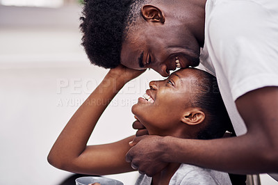 Buy stock photo Shot of an affectionate couple at home
