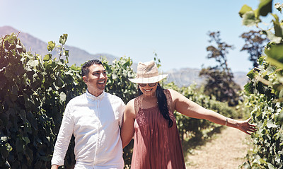 Buy stock photo Couple, happy and vineyard date in nature for bonding, anniversary or honeymoon with blue sky in summer. People, walking and smile in wine plantation with sunshine, landscape and romantic vacation