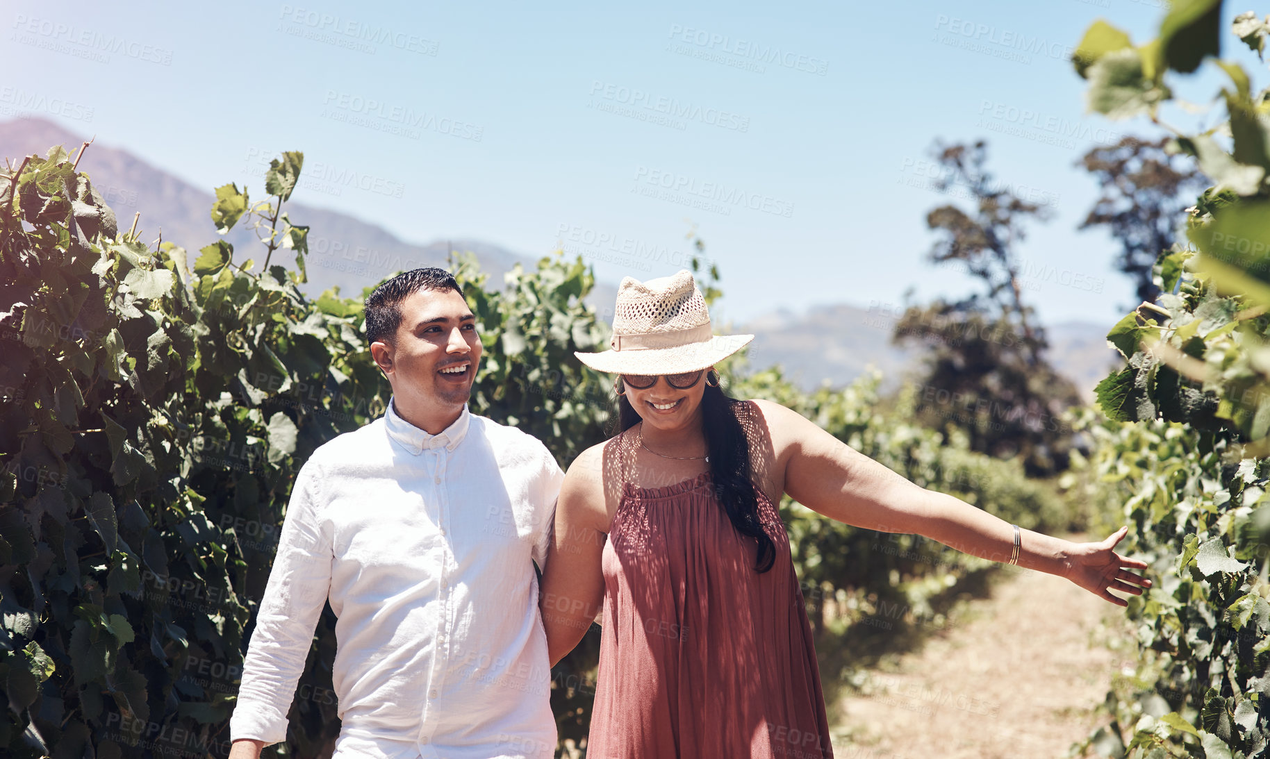 Buy stock photo Shot of a young couple out on a date at a vineyard