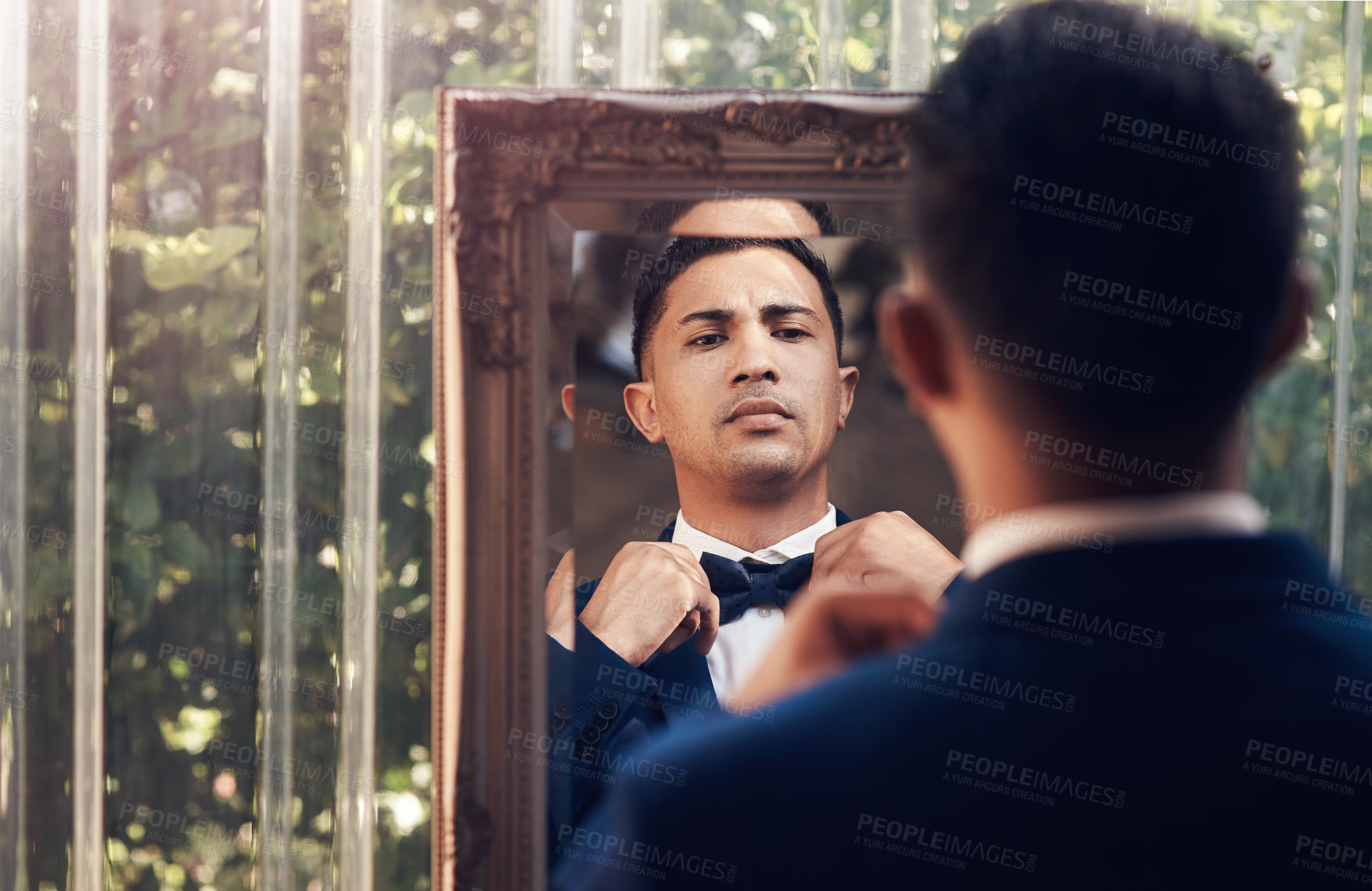 Buy stock photo Mirror, wedding and man with a bow tie, marriage and prepare for ceremony, love and celebration. Male person, gentleman and groom with a suit, fashion and ready for event with romance and reflection