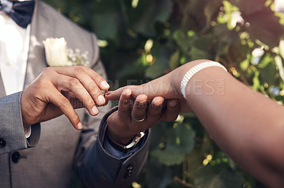 Buy stock photo Cropped shot of an unrecognizable couple exchanging rings during their wedding ceremony