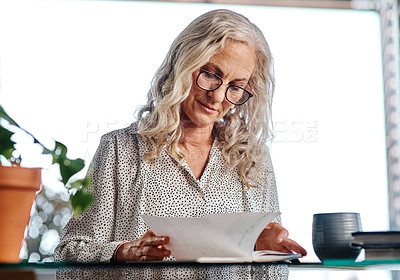 Buy stock photo Cropped shot of an attractive senior businesswoman working from home