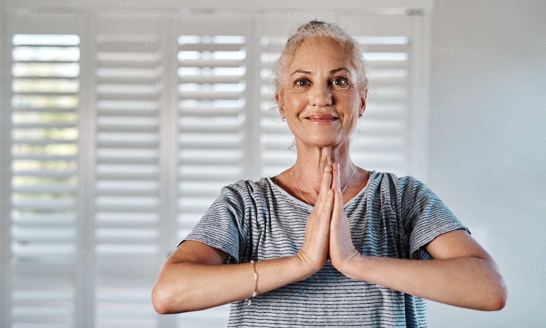 Buy stock photo Portrait of a cheerful mature woman practicing yoga inside of a studio during the day
