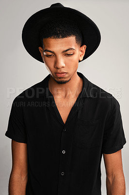 Buy stock photo Confidence, hat and man with fashion, gen z and stylish clothes on gray studio background. Person, model and guy with trendy outfit, edgy and fabric with casual, thinking and decision with choice