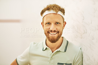 Buy stock photo Shot of a confident young man standing on a squash court