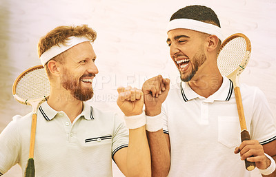 Buy stock photo Shot of two young men fist bumping before playing a game of squash