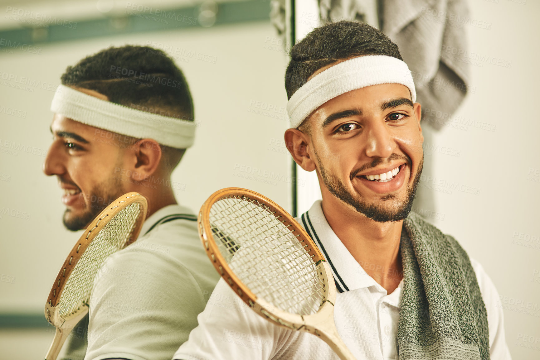 Buy stock photo Shot of a young man in the locker room after a game of squash