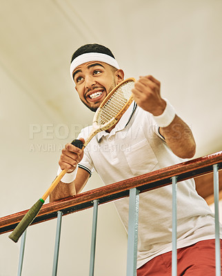 Buy stock photo Player, squash court and man with fitness, smile and competitive with racket, training and break. Recreation, person and athlete in locker room, wellness and health center for activity, joy and hobby