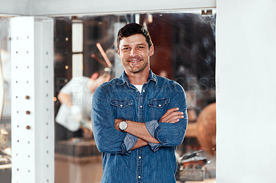 Buy stock photo Portrait of a handsome young businessman posing in an office inside his workshop