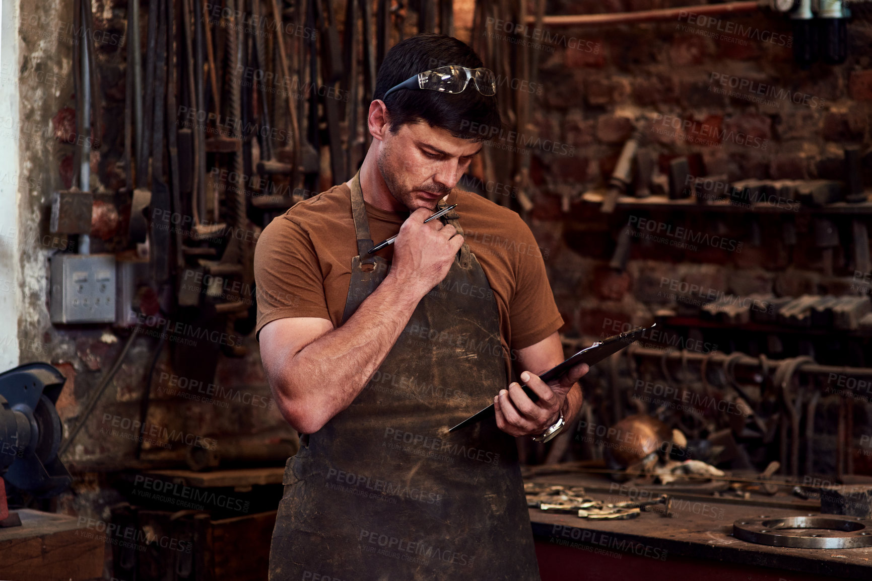 Buy stock photo Man, craftsman and thinking with tablet in workshop for welding project, metal manufacturing or planning. Blacksmith, entrepreneur and small business owner with technology for steel research or ideas