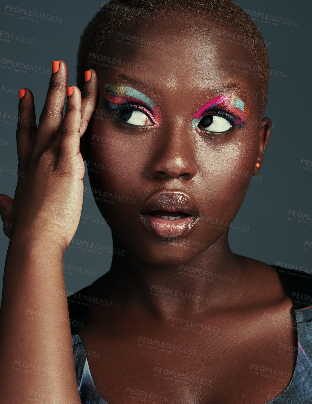 Buy stock photo Black woman, studio and makeup for beauty cosmetics or aesthetics with bright eyeshadow on grey background. Female person, art and creativity with rolling eyes for luxury, glamour and confidence