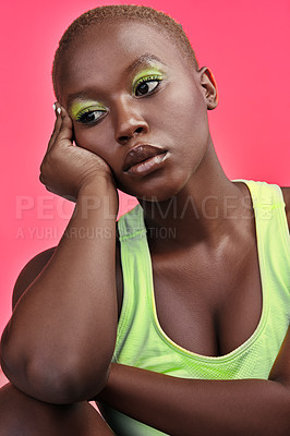 Buy stock photo Bored, studio or black woman with makeup, beauty or gen z aesthetic thinking of modern cosmetics. Moody, trendy model or creative eye shadow with skin glow, neon color or attitude on pink background