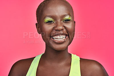 Buy stock photo Shot of a beautiful young woman wearing makeup while posing against a pink background