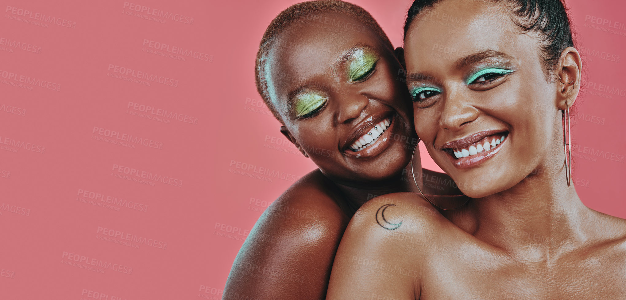 Buy stock photo Shot of two beautiful young women posing together against a pink background