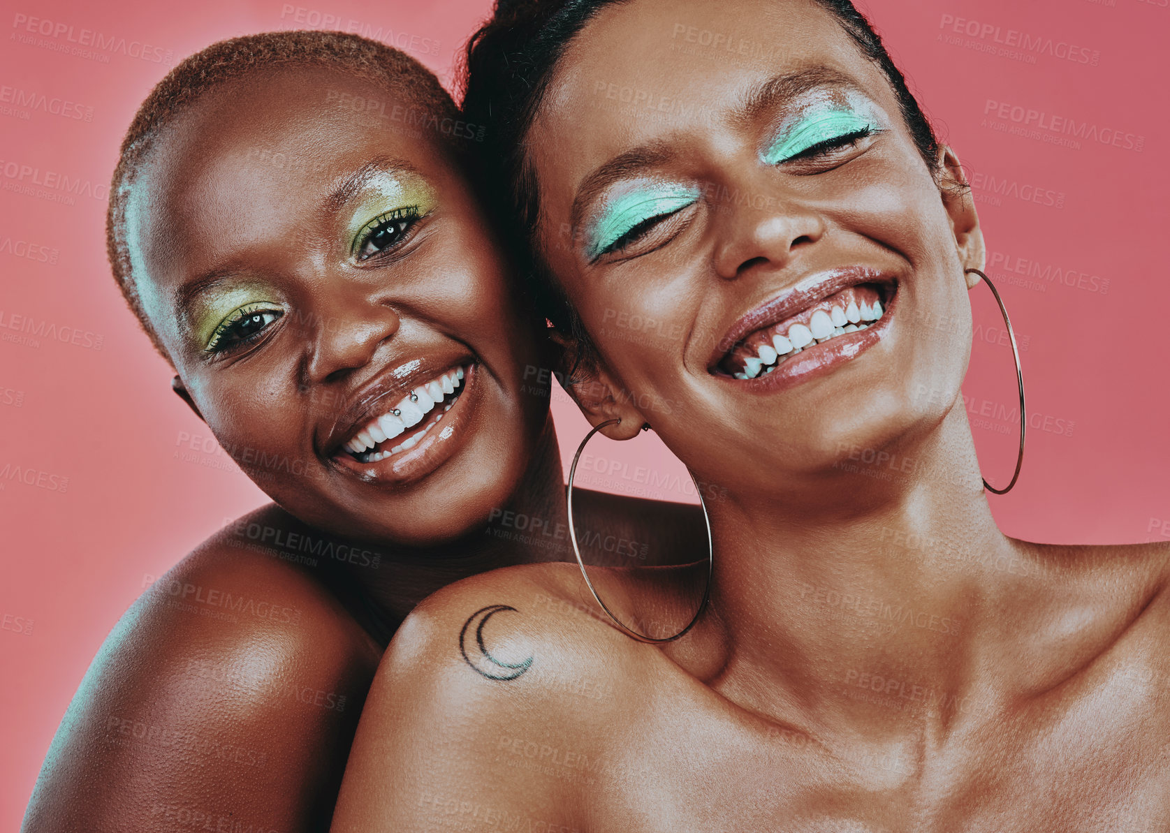 Buy stock photo Shot of two beautiful young women posing together against a pink background