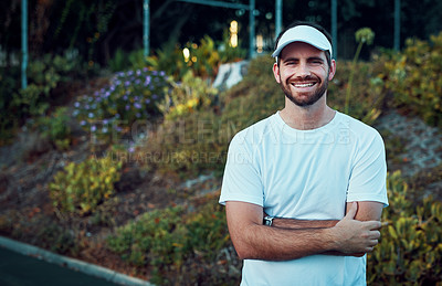 Buy stock photo Portrait of a sporty young man standing on a tennis court