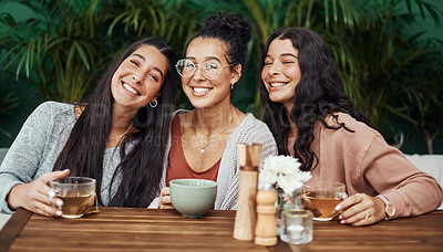 Buy stock photo Shot of young sisters spending quality time at a cafe