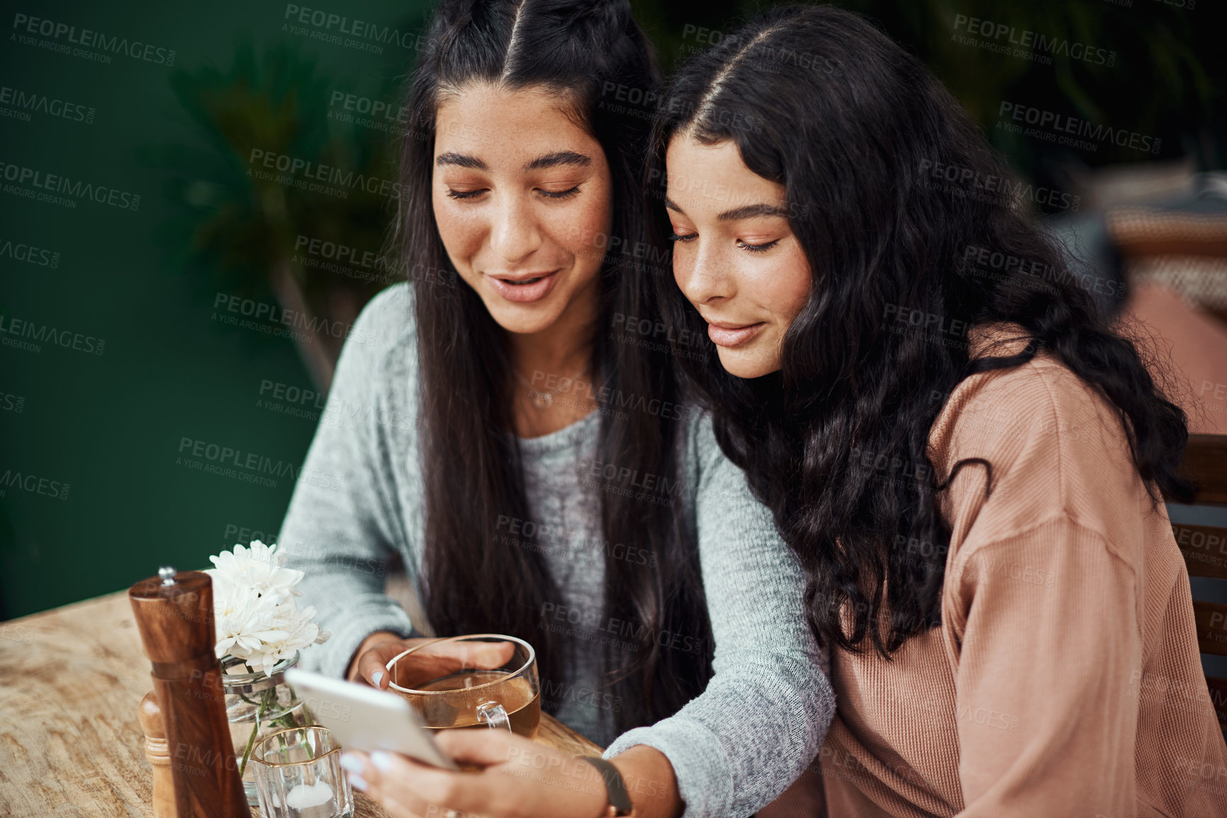 Buy stock photo Woman, friends and phone for cafe online discount, registration or sign up for loyalty points. Happy young people or students on mobile app for reading menu, catalog or social media and drinking tea