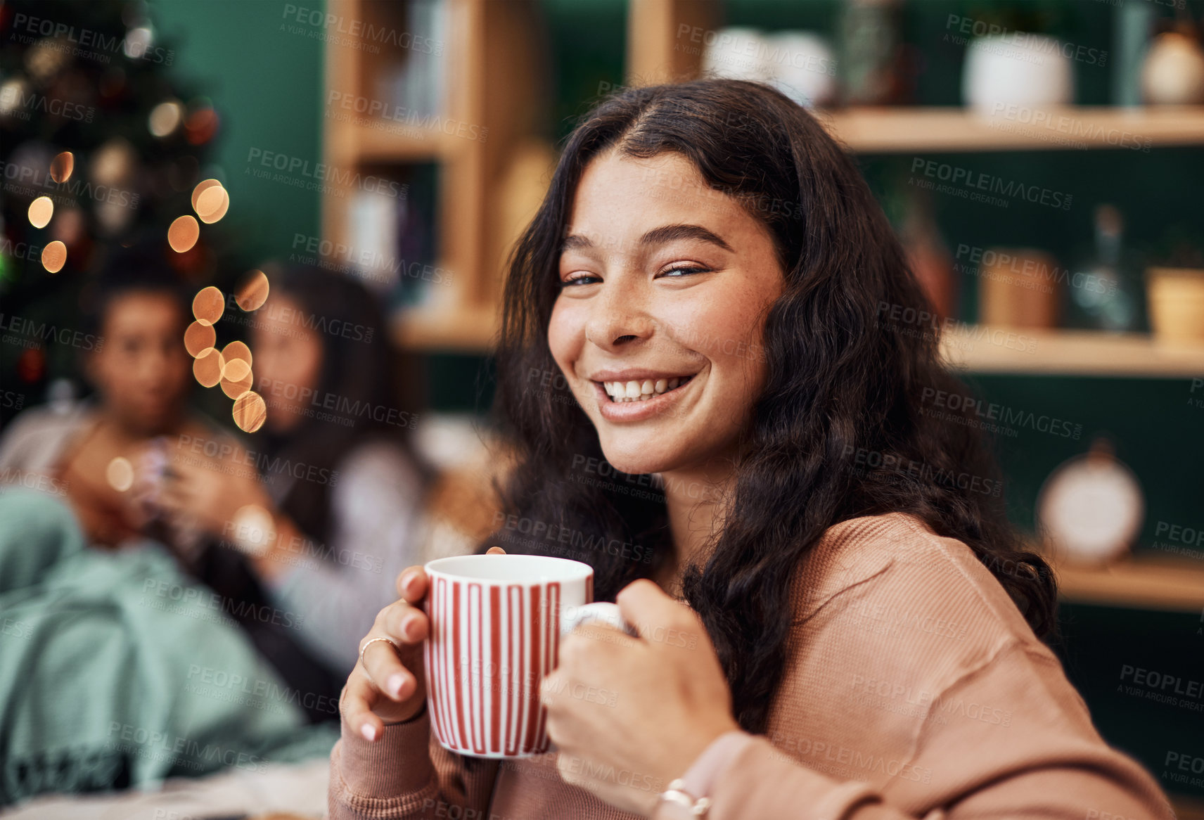 Buy stock photo Portrait, teen and happy girl on couch with coffee, beverage and hot chocolate to relax on Christmas holiday. Lounge, friendship and female person with festive spirit, joy and mug for drink at home