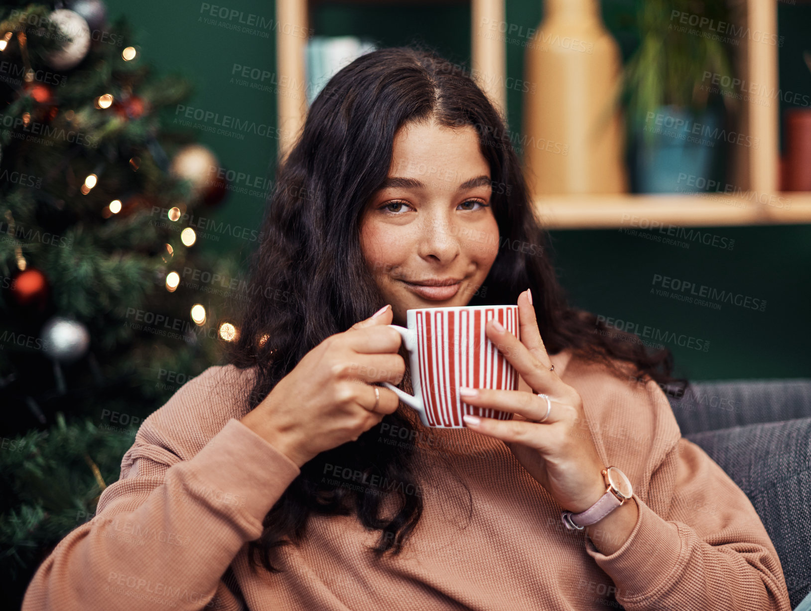 Buy stock photo Girl, portrait and drinking tea on Christmas in home, traditional beverage and festive season. Female person, smile and cozy celebration in December, hot chocolate and relax in lounge on holiday