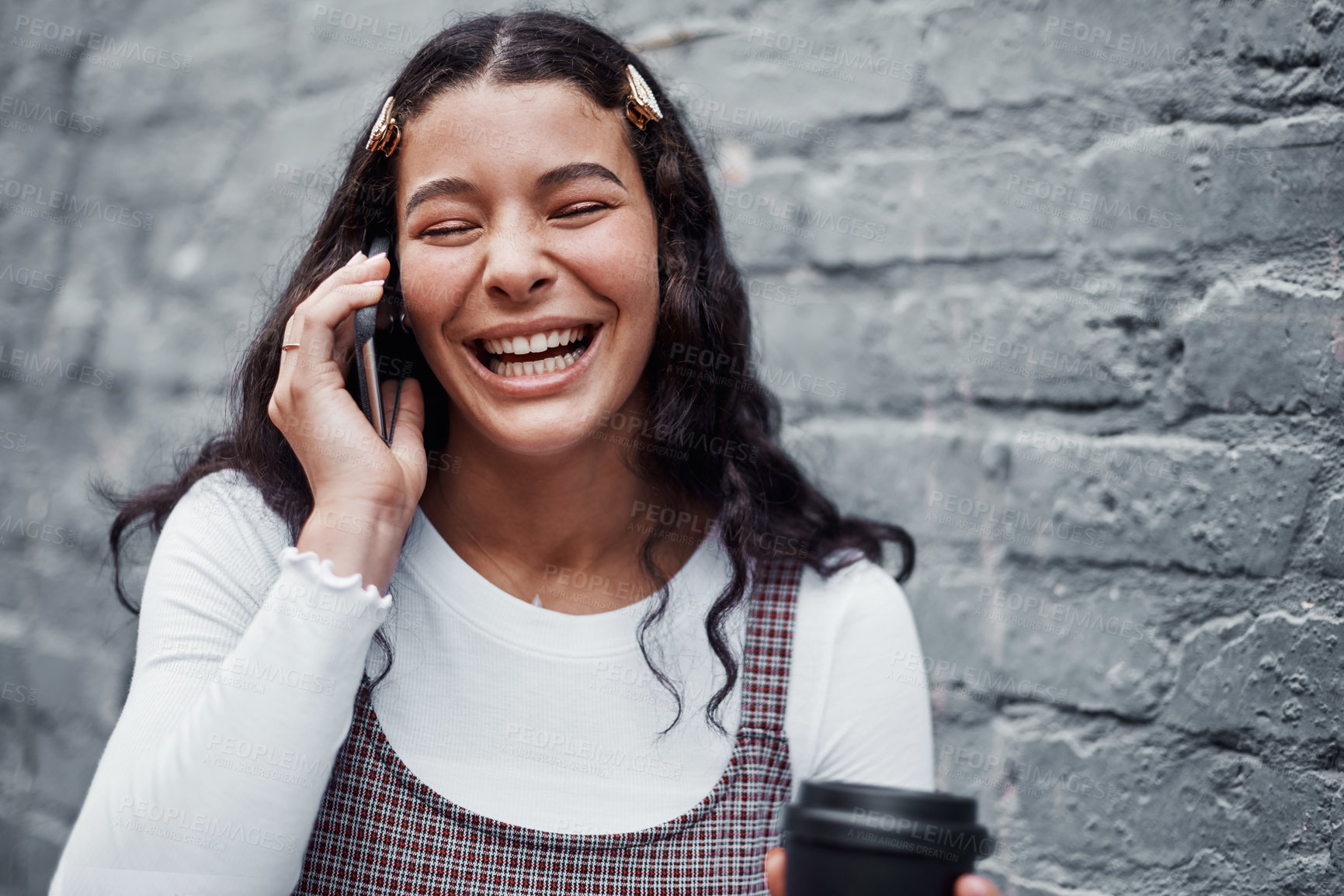 Buy stock photo Woman, phone call and laughing in street for communication, conversation and joke in city. Student, gen z or girl and networking by gray wall in New York with technology for comedy and connection 