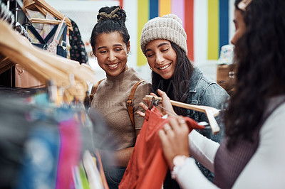 Buy stock photo Cropped shot of an attractive group of sisters bonding together during a shopping spree in the city
