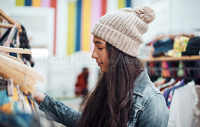 Buy stock photo Cropped shot of an attractive teenage girl standing alone and shopping in the city during the day