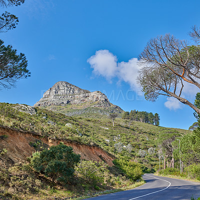 Buy stock photo Copyspace with a mountain pass along Lions Head in Cape Town, South Africa against a blue sky background. Breathtaking panoramic of an iconic landmark and travel destination to explore on a road trip