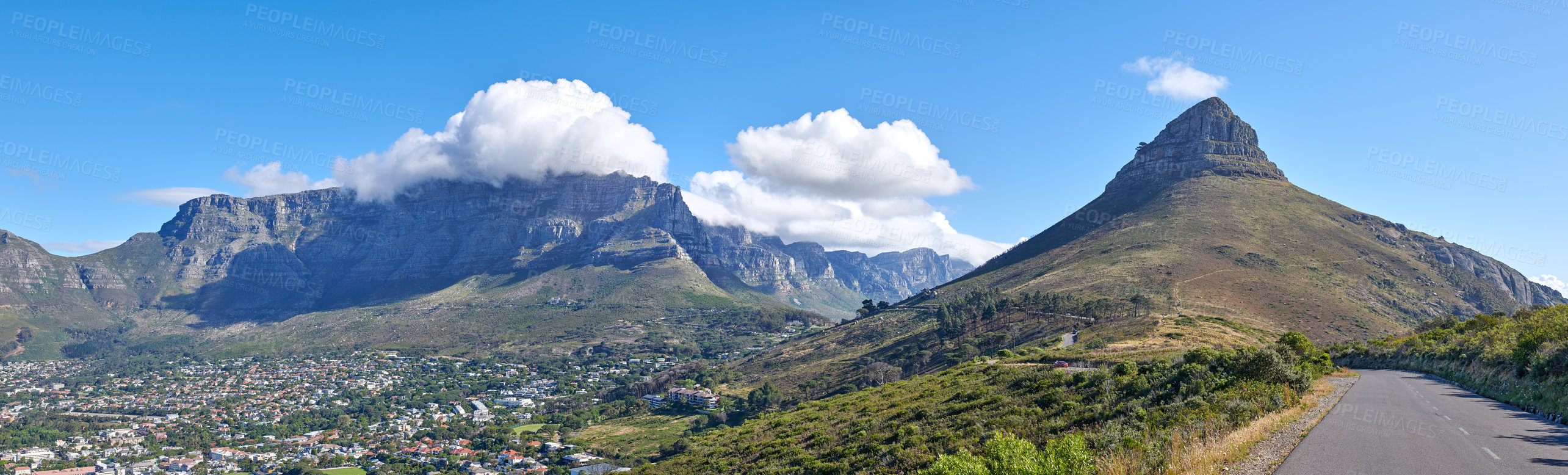 Buy stock photo Copyspace with a mountain pass along Lions Head and Table Mountain in Cape Town, South Africa against a cloudy sky background over a peninsula. calm, scenic landscape to travel explore on a road trip