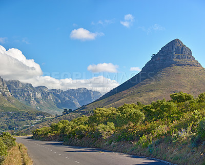 Buy stock photo Landscape view of Lions Head mountain and the Twelve Apostles with blue sky with copy space in Cape Town, South Africa. Serene and tranquil asphalt road in the countryside in natural scenery.