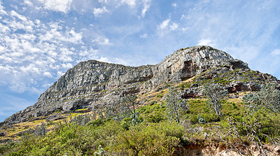 Buy stock photo Landscape view of Lions Head and its natural surroundings in summer. Scenic view of a popular natural landmark in Cape Town, South Africa against a cloudy blue sky. Travel destination for tourists