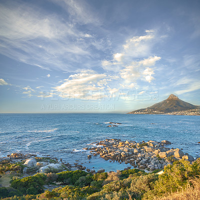 Buy stock photo Landscape Lions Head and surroundings against a blue sky during the day in summer. Beautiful ocean and mountain scenery for relaxation. Small town by the beach for tourism and getaway vacations
