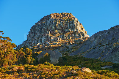 Buy stock photo Low angle of a mountain peak in South Africa. Scenic landscape of a remote hiking location on Lions Head in Cape Town on a sunny day with copy space. Stunning adventure and travel place to explore