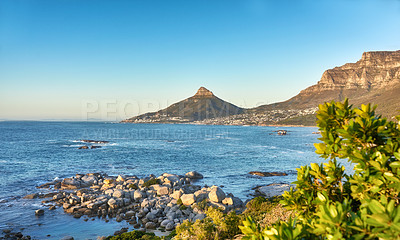Buy stock photo A coastal beach along Lions Head and Table Mountain in Cape Town, South Africa against a blue sky background over the peninsula. Calm and scenic landscape with iconic landmarks outdoors 