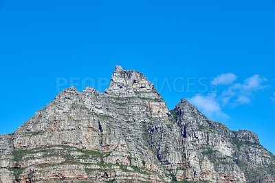 Buy stock photo A scenic landscape view of Table Mountain in Cape Town, South Africa against a blue sky background from below. Magnificent panoramic of an iconic landmark and famous travel destination with copyspace