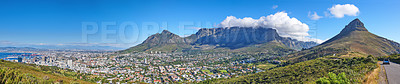 Buy stock photo Wide angle of Cape Town and mountain landscape on a sunny day. Panoramic view of a city against a blue horizon. A popular travel destination for tourists and hikers, in Lion's Head, South Africa