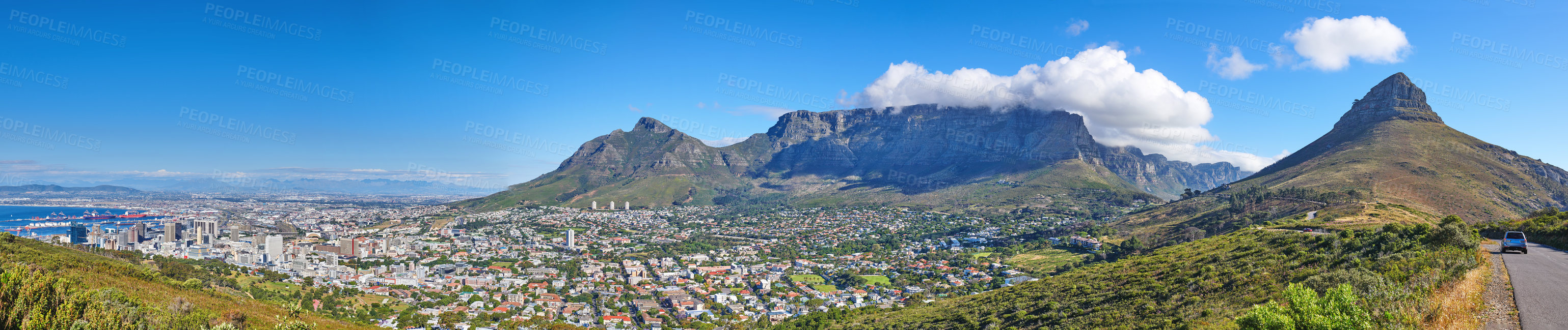 Buy stock photo Wide angle of Cape Town and mountain landscape on a sunny day. Panoramic view of a city against a blue horizon. A popular travel destination for tourists and hikers, in Lion's Head, South Africa