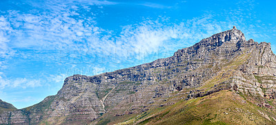 Buy stock photo Landscape of Table mountain, Cape Town, South Africa with copyspace. Panoramic view of rocky terrain with bright blue sky in the background during summer. Scenic view of Africas tourist destination