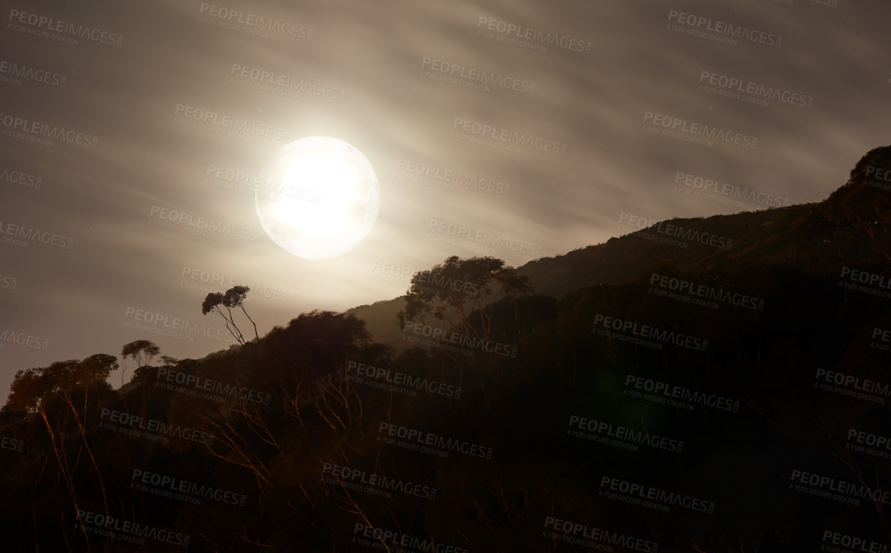 Buy stock photo Silhouette of a strange landscape at night with a bright shining full moon in South Africa. Mysterious dark nature scene of a remote location in the evening. Spooky black and white hill with shadows