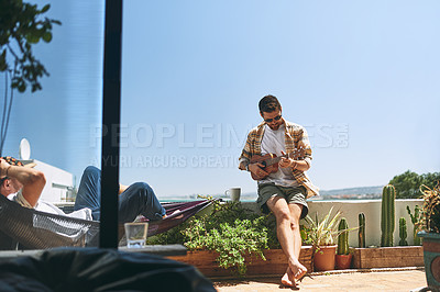 Buy stock photo People, men and playing guitar outdoor for music, favorite song or entertainment on summer vacation. Friends, artist and musician with instrument on balcony for hobby and relax together with mockup