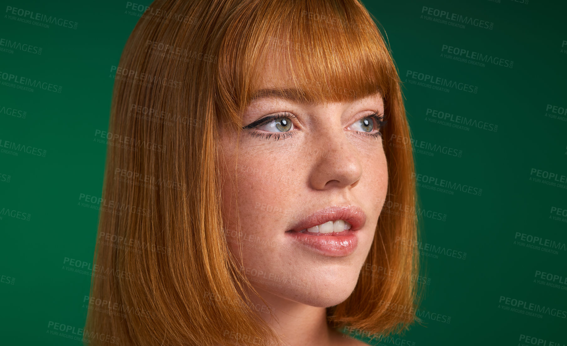 Buy stock photo Cropped shot of an attractive young sportswoman standing alone against a green background in the studio