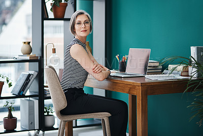 Buy stock photo Cropped shot of a mature businesswoman sitting in a modern office