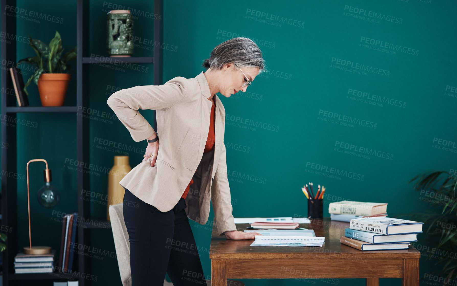 Buy stock photo Back pain, fatigue and posture with business woman on green background in office for management. Anatomy, burnout or medical and mature employee on mockup space at workplace with spine injury