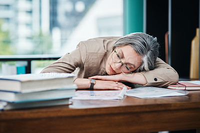 Buy stock photo Cropped shot of an attractive mature businesswoman asleep at her desk in her home office
