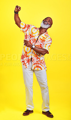 Buy stock photo Full length shot of a funky and stylish senior man dancing in studio against a yellow background