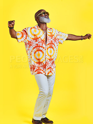 Buy stock photo Black man, dancing and sunglasses in studio with energy, freedom and summer fashion. Mature person, winner and movement on yellow background with positive attitude, party and birthday celebration